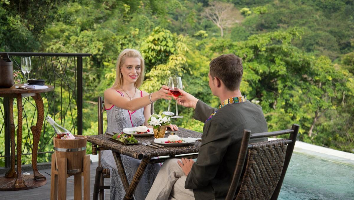 Keemala Hotel Kamala Beach Exterior photo A couple toasting with wine