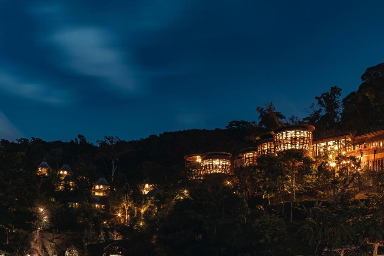 Keemala Hotel Kamala Beach Exterior photo The resort at night